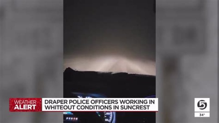Draper police officers helped stuck cars in whiteout conditions