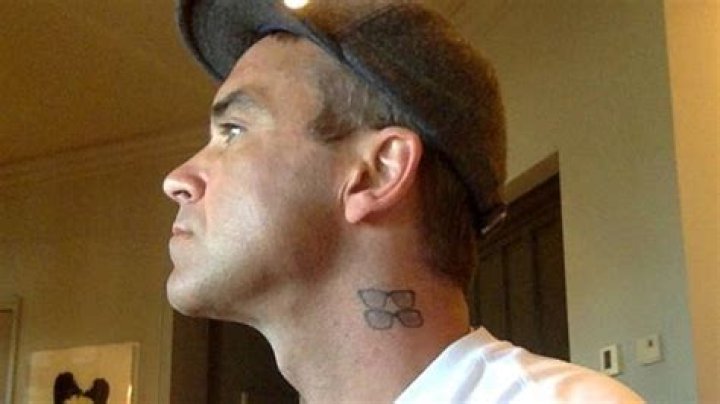 Robbie Williams tattoos explained: Two Ronnies, children tributes and more